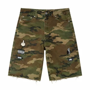 Shop Project Capri Camo Denim Jorts featuring premium camouflage denim, graphic patches, a relaxed fit, and everyday streetwear Project Capri Camo Denim Jortsstyle.